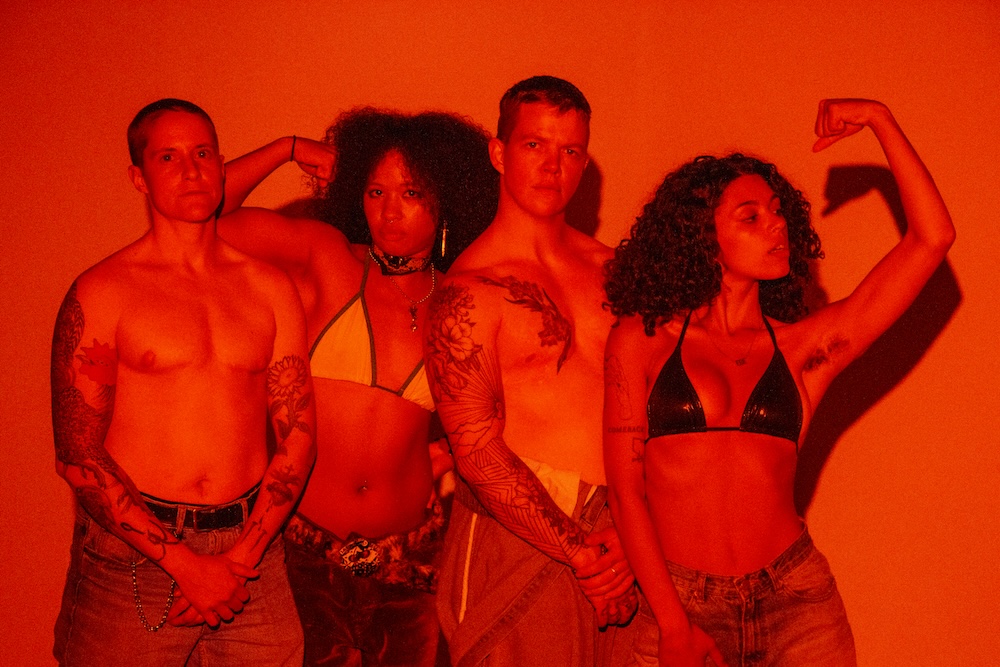 This is a photo of four-piece Monica Bang comprised of femmes, thems, and trans musicians. The bandmates are in a stylized photoshoot. Kyra and Mareko wear bikinis. Jenno and OB are shirtless.